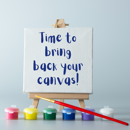 Mini easel with paints and brush